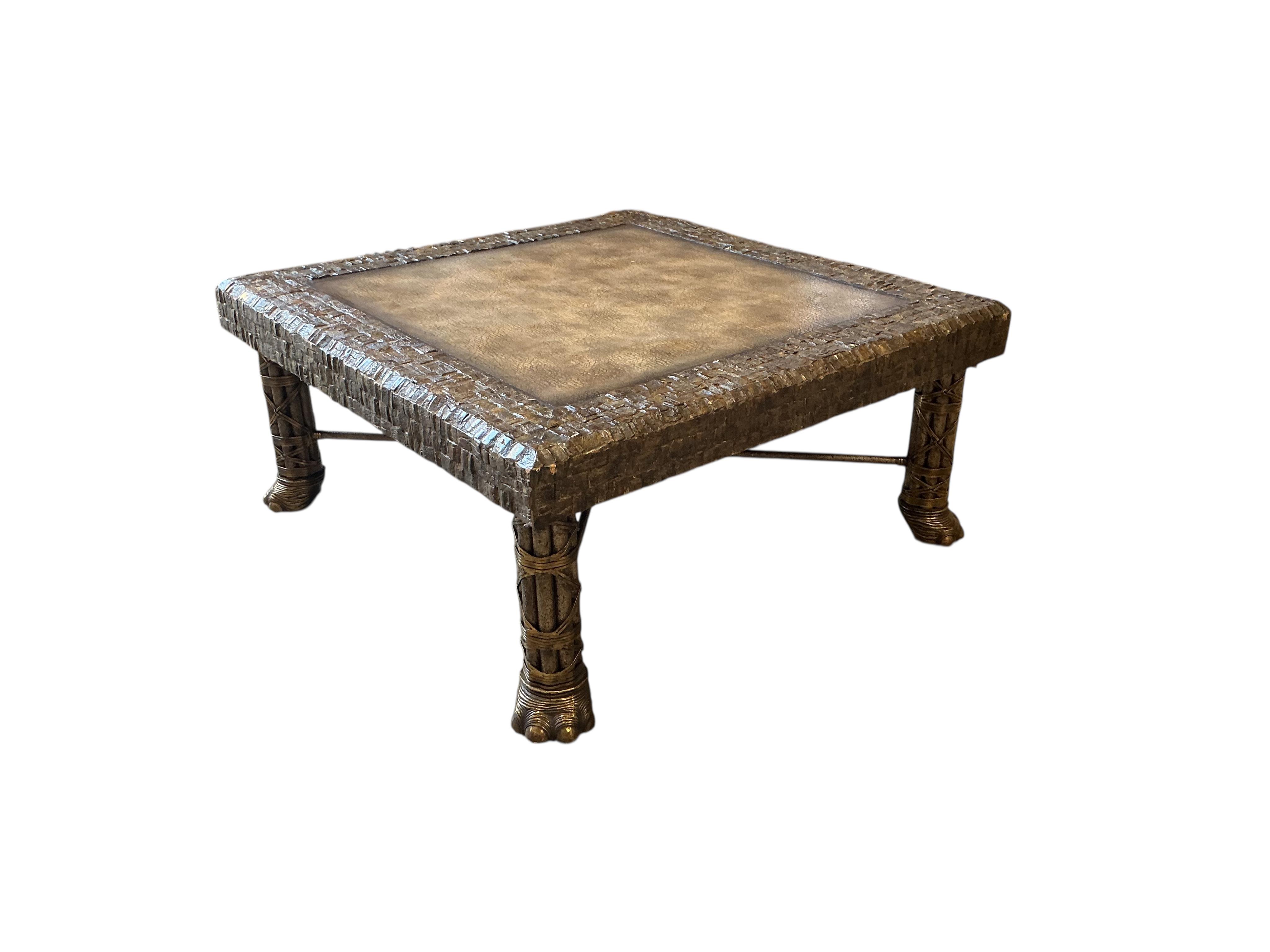 A Contemporary Maitland Smith square brass, leather top coffee table on cluster column, elephant foot supports, 108cm, height 48cm